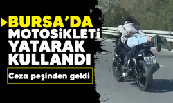 Bursa'da motosikleti yatarak kullandı: Ceza peşinden geldi